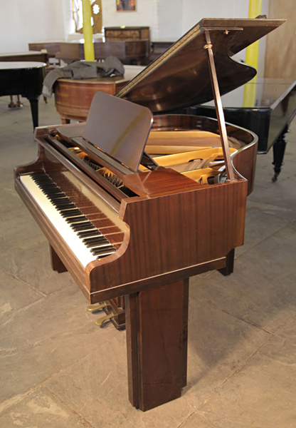 Art Deco, 1939, Allison baby grand piano with a polished mahogany case. Legs and lyre feature strong geometric styling. Piano has an eighty-five note keyboard and a two-pedal piano lyre. 