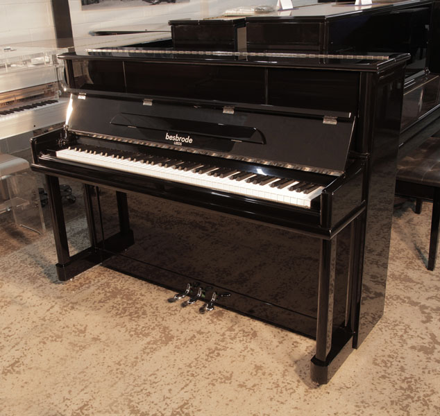 As new, 2020, Besbrode SU112  upright piano for sale with a black gloss case and chrome fittings Piano has an eighty-eight note keyboard and three pedals.  