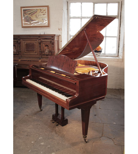 Reconditioned, 1934, Bluthner Model 10 baby grand piano with a figured, mahogany case and square, tapered legs. Piano has an eighty-eight note keyboard and a two-pedal lyre.