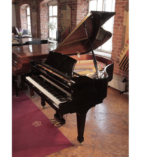 Reconditioned 2000, Boston GP156 II baby grand piano with a black gloss case and brass fittings. Piano has an eighty-eight note keyboard and a three-pedal lyre. 