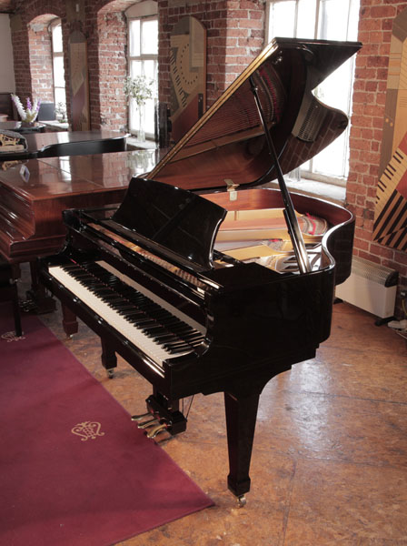 Reconditioned 2000, Boston GP156 baby grand piano for sale with a black case and spade legs. Piano has an eighty-eight note keyboard and a three-pedal lyre.