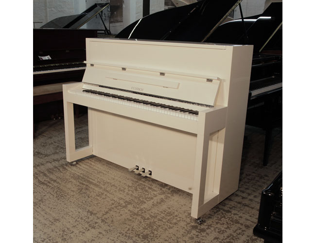 New Feurich Model 115 Premiere upright piano with a Bauhaus style, white gloss with chrome fittings. Piano has an eighty-eight note keyboard and three pedals.