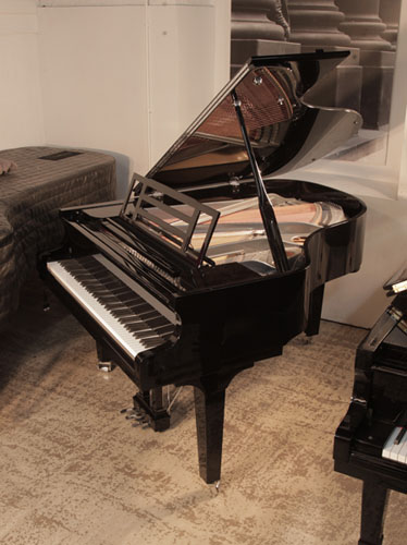 Brand new, Feurich Model 179 Dynamic II grand piano in black gloss with chrome fittings. Piano has an eighty-eight note keyboard and a three-pedal piano lyre. 