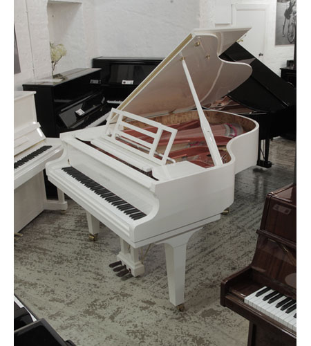 Brand new, Feurich F179 Dynamic grand piano in white gloss with brass fittings. Music desk features adjustable LED lighting.  Piano has an eighty-eight note keyboard and a three-pedal piano lyre. 