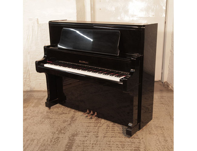 Reconditioned, 1982, Kawai US-50 upright piano for sale with a black gloss case and wide music desk.