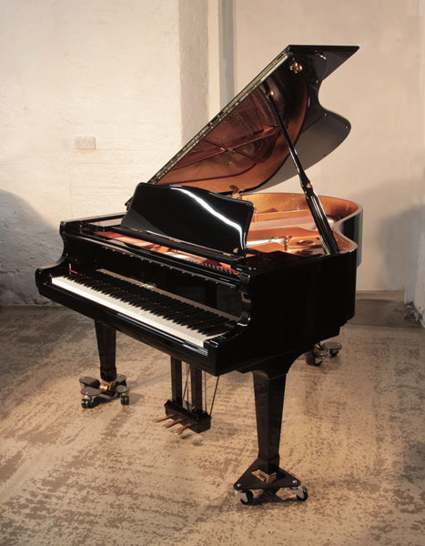 As new, 2024,   Shigeru Kawai SK-2      grand piano for sale with a black gloss case. Piano has an eighty-eight note keyboard and a three-pedal lyre.