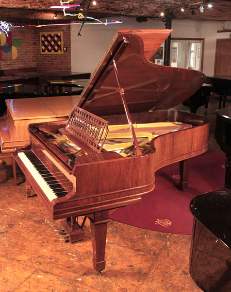 Restored, 1911,  Steinway Model B grand piano for sale with a rosewood case, openwork music desk and spade legs 