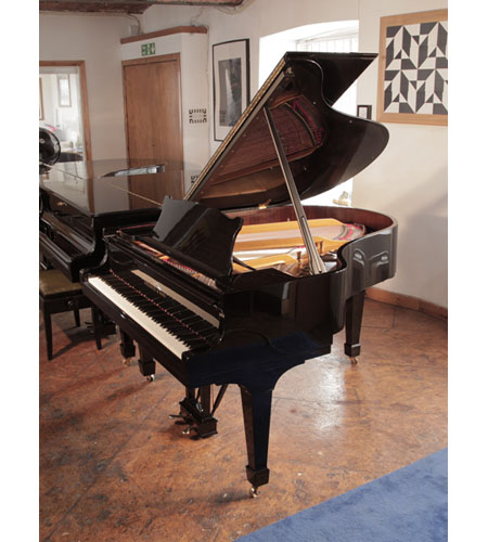 Rebuilt, 1961, Steinway Model M grand piano for sale with a black gloss case. Piano has an eighty-eight note keyboard and a two-pedal lyre.  