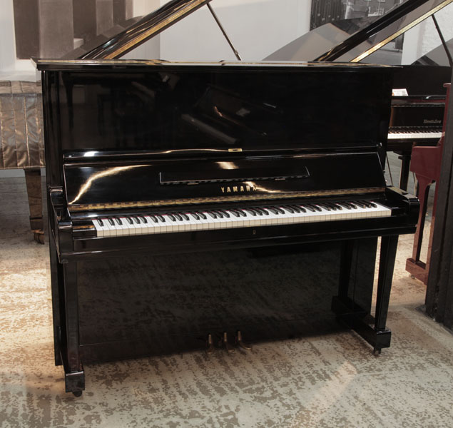Reconditioned, 1957, Yamaha U3  upright piano for sale with a black gloss case and brass fittings. Piano has an eighty-eight note keyboard and three pedals.  