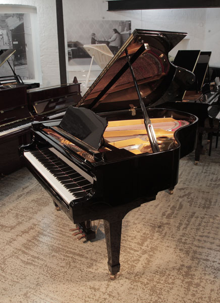 Reconditioned 2011, Young Chang G-185 professional  grand piano for sale with a black gloss case. Piano has an eighty-eight note keyboard and a three-pedal lyre. 